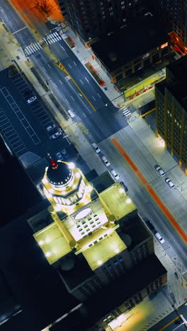 view of the city hall tower and well-lit street in front of it in philadelphia, pennsylvania, usa. vertical video