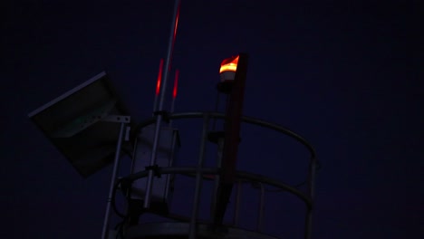 a navigation light turning on at dusk