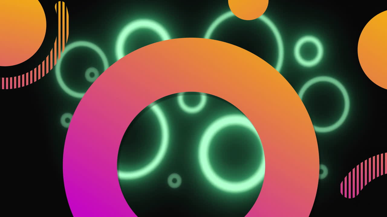 Animation of glowing green rings and colorful abstract shapes on dark background