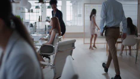 diverse business people working in busy office brainstorming corporate workplace with multitasking colleagues collaborating