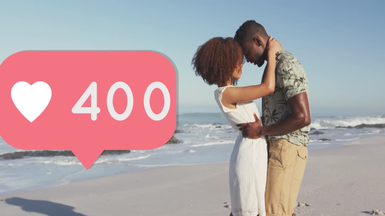 Heart icon with increasing numbers against african american couple embracing each other on the beach