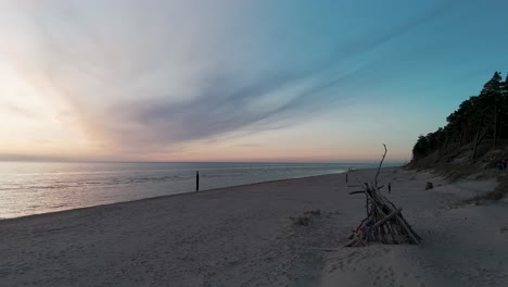 Aerial-Birdseye-View-of-Baltic-Sea-Coast-on-a-Sunny-Day,-Seashore-Dunes-Damaged-by-Waves,-Broken-Pine-Trees,-Coastal-Erosion,-Climate-Changes,-Wide-Angle-Drone-Shot