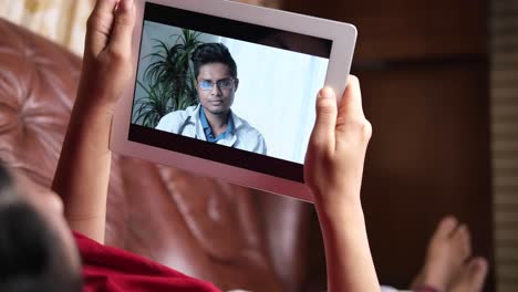 video call with a doctor on a tablet