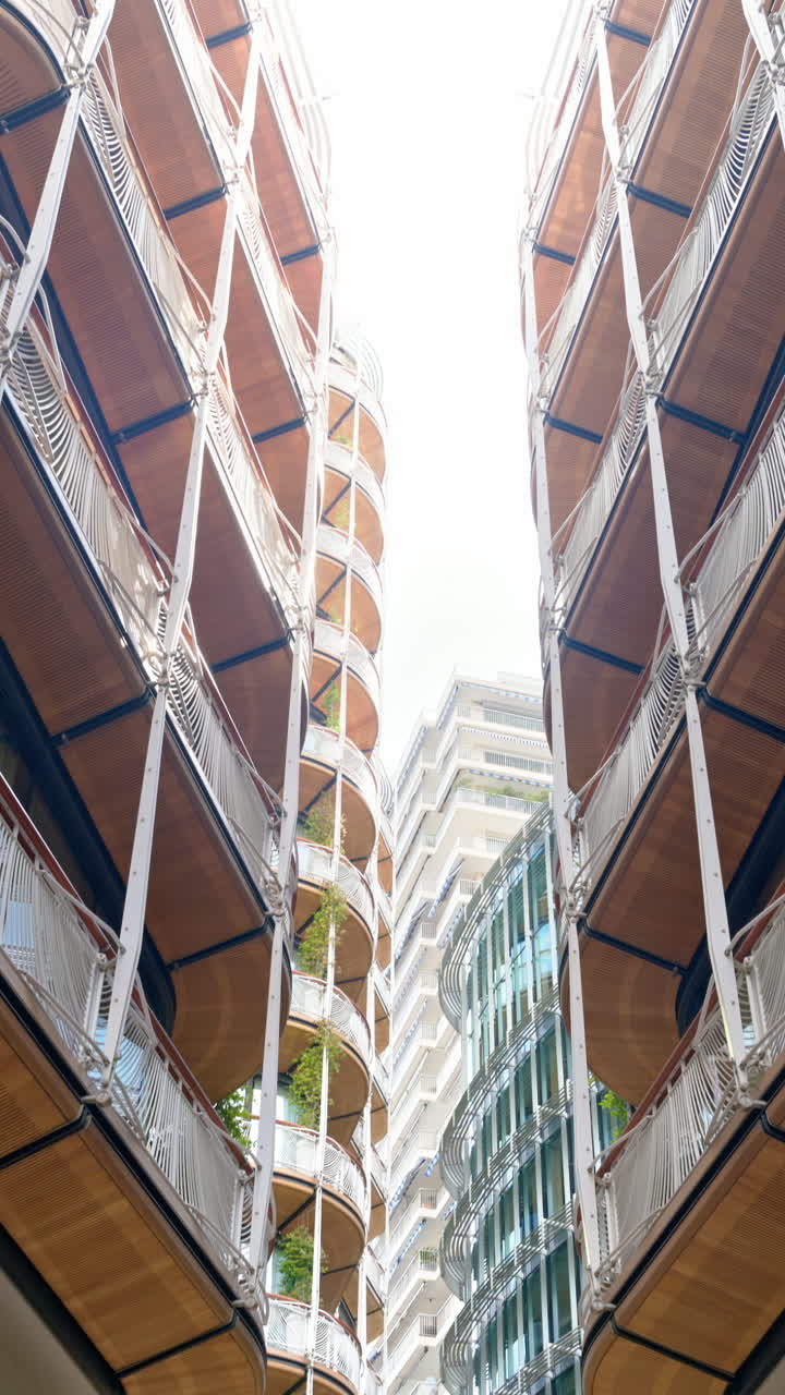 Low angle view of buildings on a shopping street in Monte Carlo, Monaco. Vertical