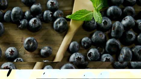 Fresh-blueberries-and-mint-on-wooden-table-4k