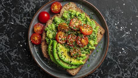 avocado toast with cherry tomatoes and sesame seeds