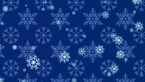 animation of christmas snowflakes falling on blue snowy background