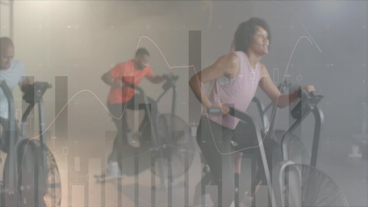 Animation of data processing on graph over biracial woman cross training on elliptical at gym