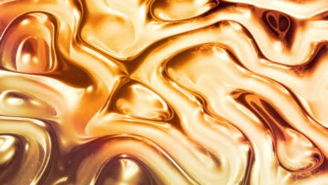 looped abstract background with wavy sparkling golden liquid pattern on shiny glossy surface. viscous yellow fluid like surface of gold foil or brilliant glass. beautiful creative festive backdrop.