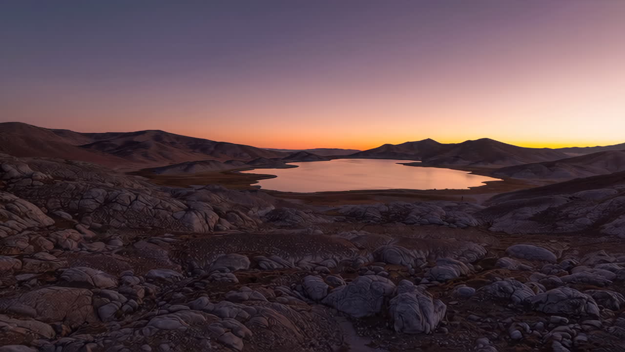 Sunrise or Sunset over a Mountain Lake