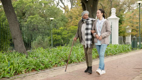 Nurse,-support-and-cane-with-old-woman-in-park