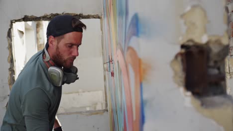 Graffiti-artist-painting-with-aerosol-spray-4k