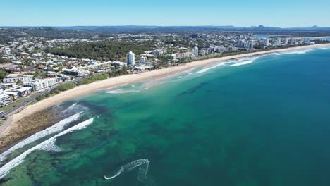 panoramic view over alexandra headland beach on a sunny summer day in queensland, australia - drone shot