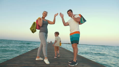 happy family walking after the shopping