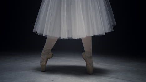 ballet dancer legs dancing on tiptoe. ballerina feet doing steps in pointe shoes