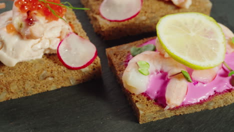 elegant and colorful canapés with seafood and beetroot