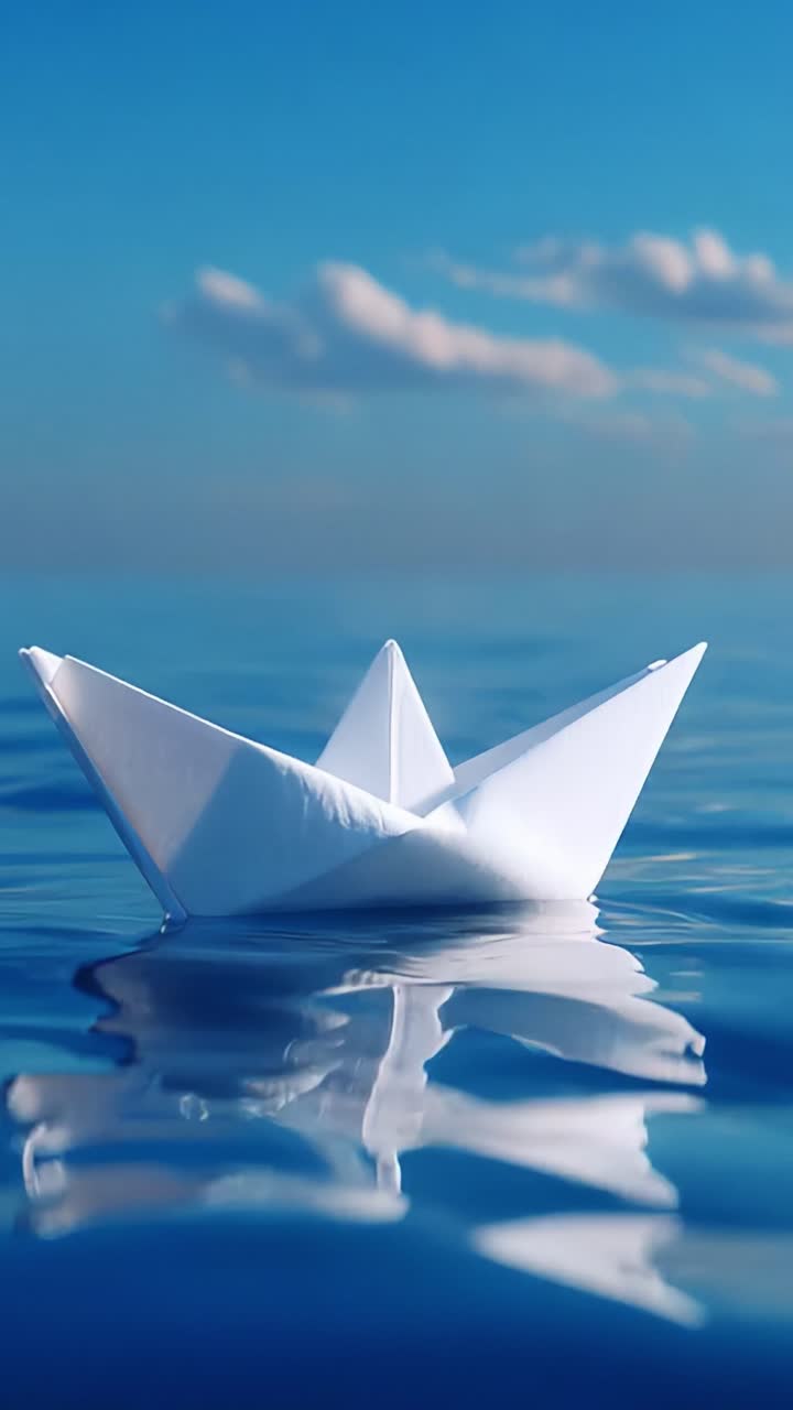 A Serene Journey: An Elegant White Paper Boat Gently Floats on the Tranquil Blue Waters Under a Beautiful Sky, Capturing the Essence of Simplicity and Peacefulness in Nature's Embrace