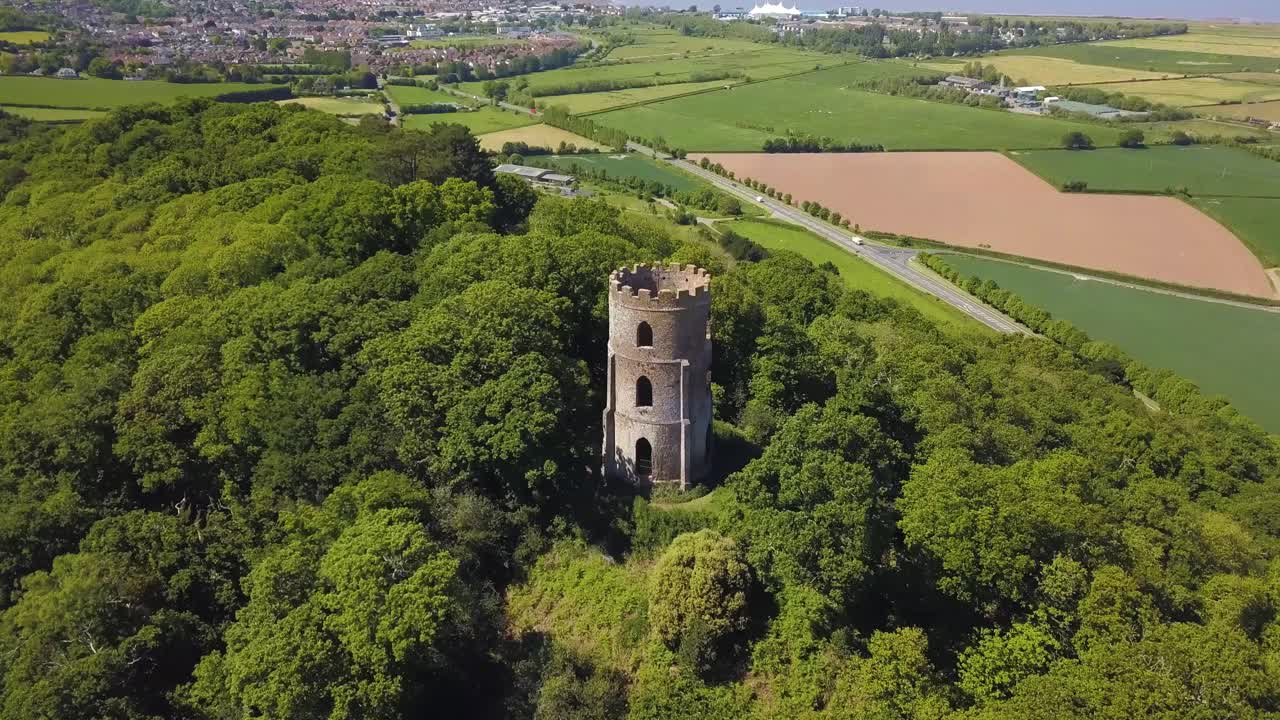 Aerial view of the Dunster Conygar tower and surrounding areas full of trees near Dunster castle, Somerset, England.