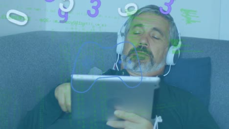 Animation-of-numebrs-and-data-processing-over-caucasian-man-with-tablet-and-headphones