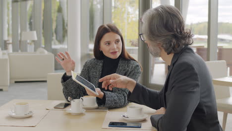 business couple talking at restaurant