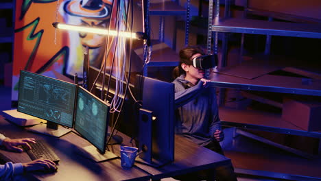hacker coding malware with vr headset