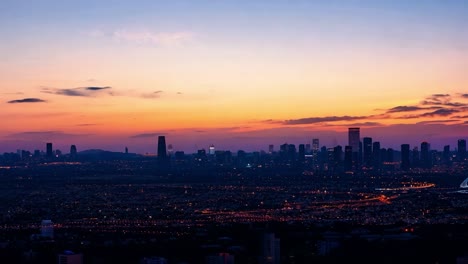 city lights gradually replacing sunset hues create a stunning transition from dusk to night over the urban skyline