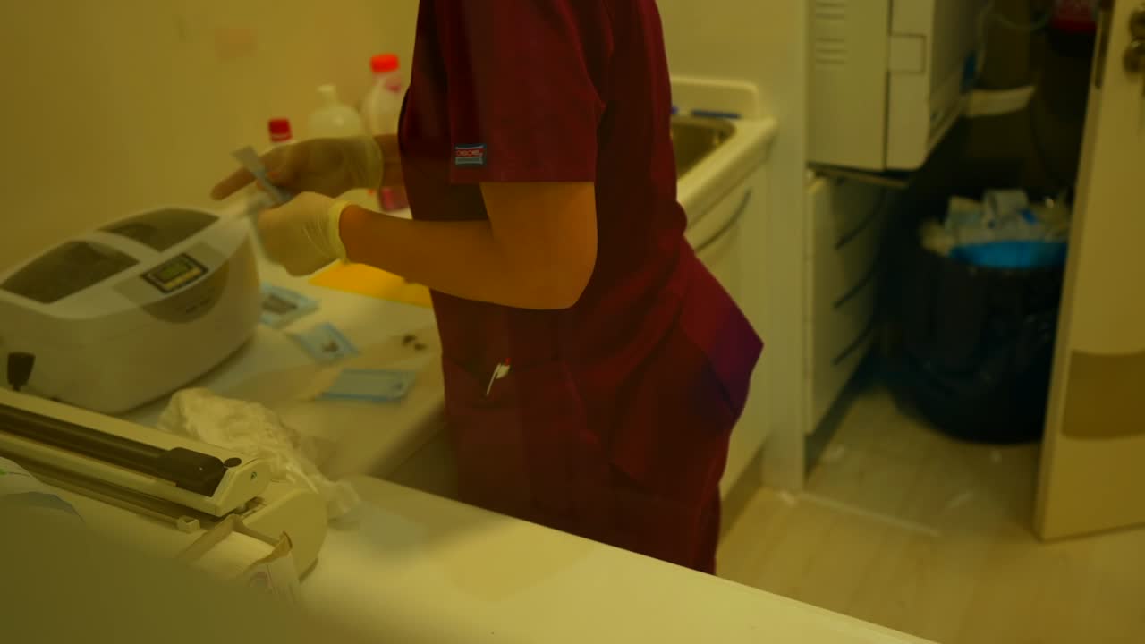 Healthcare professional preparing medical instruments