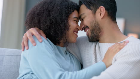 Couple,-hug-and-smile-on-sofa