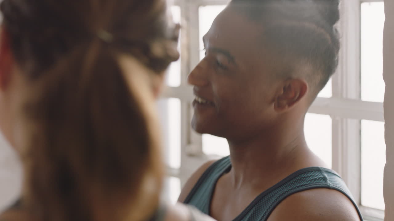 dance class multiracial friends chatting discussing fitness lifestyle sharing training tips enjoying conversation in workout studio