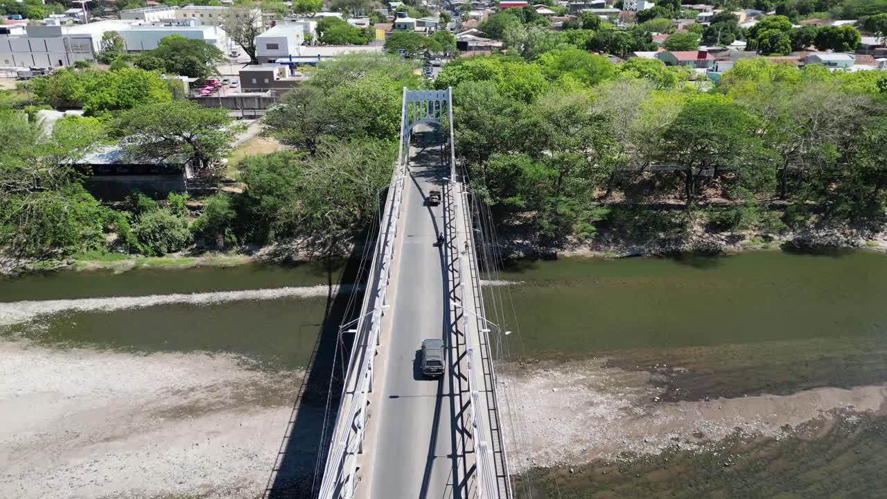 Aerial view of Choluteca, Honduras with iconic suspension bridge and urban landscape