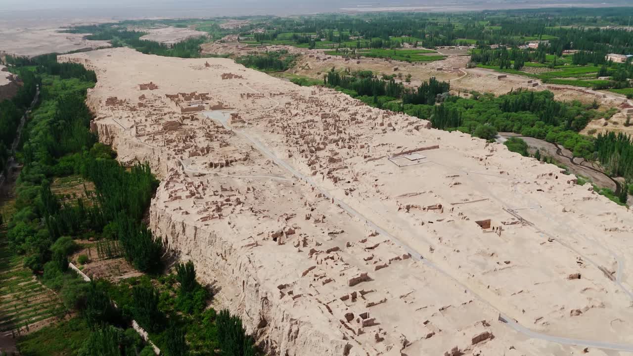 Aerial establishing fly at natural archaeological ruins in Chinese Plateau, Turpan Jiaohe landscape