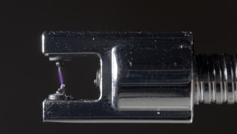 arc lighter ignition spark detail in slow motion - extreme cu 120fps