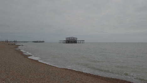 wide shot of the ocean on the south coast of england with brighton pier in the background