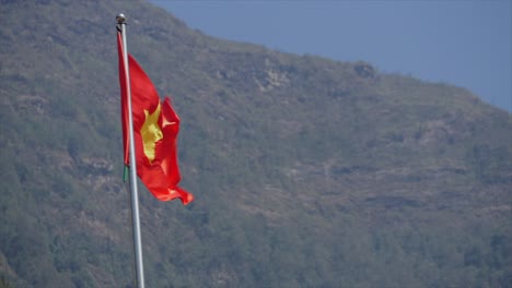 vietnam flag slomo with mountainous background