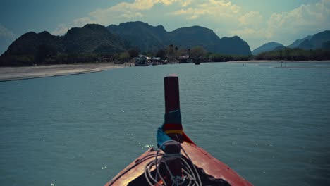 sailing toward the limestone hills in khao sam roi yot national park in thailand