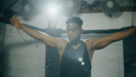 Man-Stretching-in-Gym