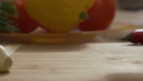 sliced onion on cutting board with vegetables