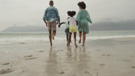 family enjoying free time by the sea