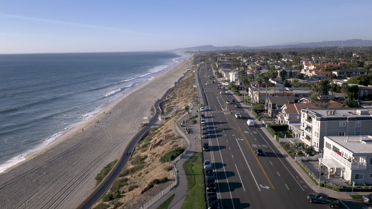Aerial View of a Coastal Road and Beachfront Residential Area
