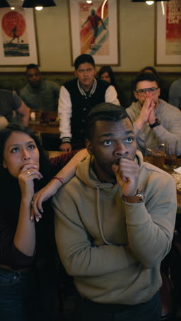 friends celebrating at a sports bar