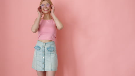 stylish woman in pink and denim outfit