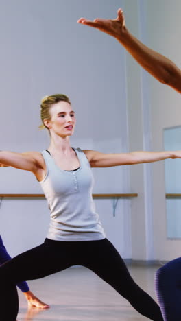 instructor taking yoga class