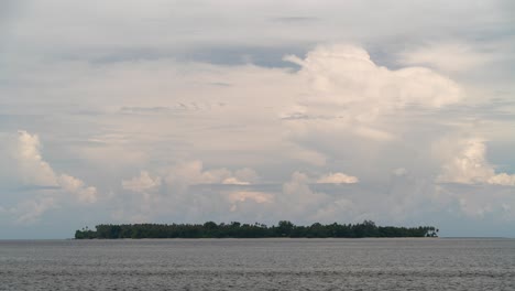 remote tropical island under a cloudy sky