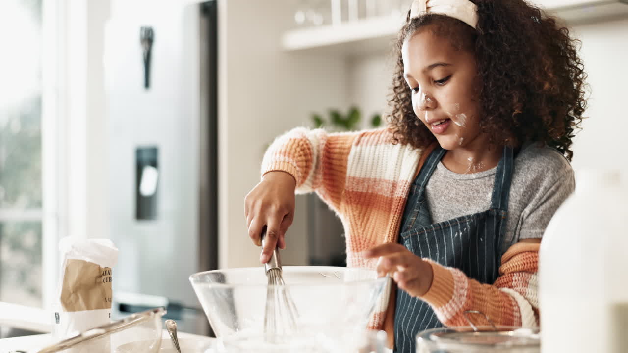 Girl having fun baking in the kitchen
