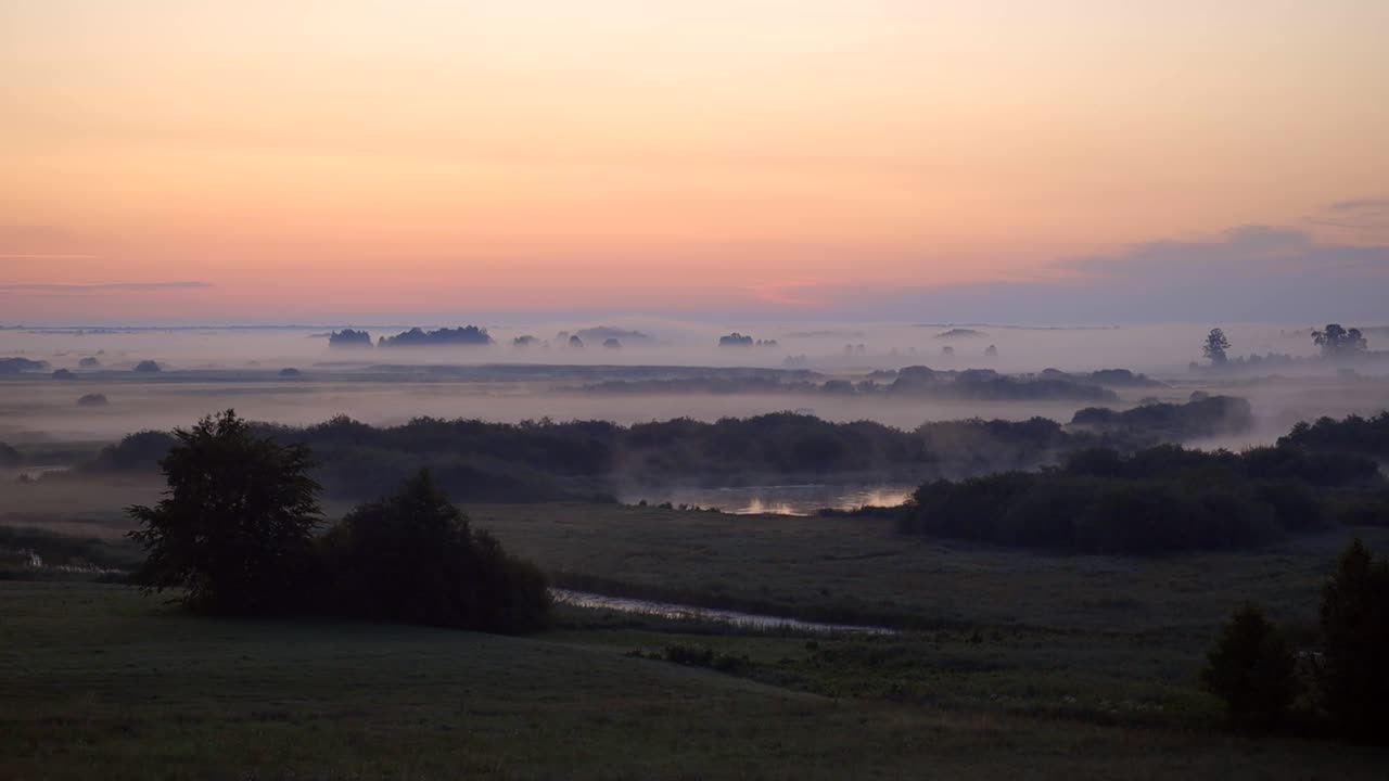 Sunrise over the pristine landscape of Poland shrouded in fog. Wide panoramic shot