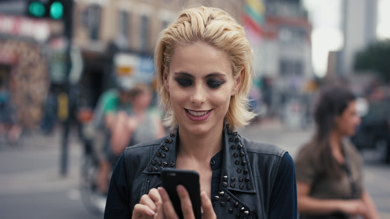 Slow Motion Portrait of happy beautiful caucasian punk woman using smart phone