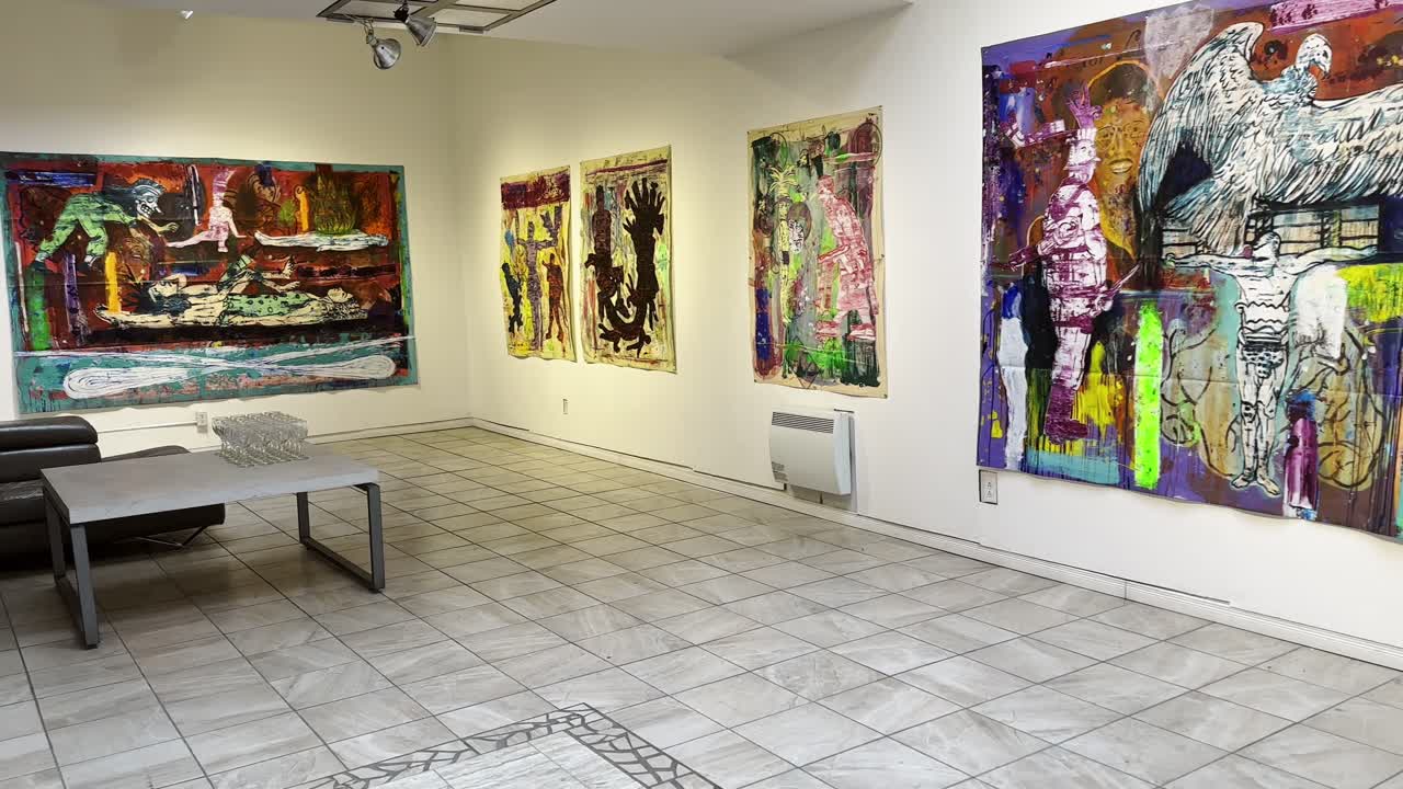 Modern art gallery exhibiting a collection of colorful abstract paintings, creating a captivating atmosphere for art enthusiasts