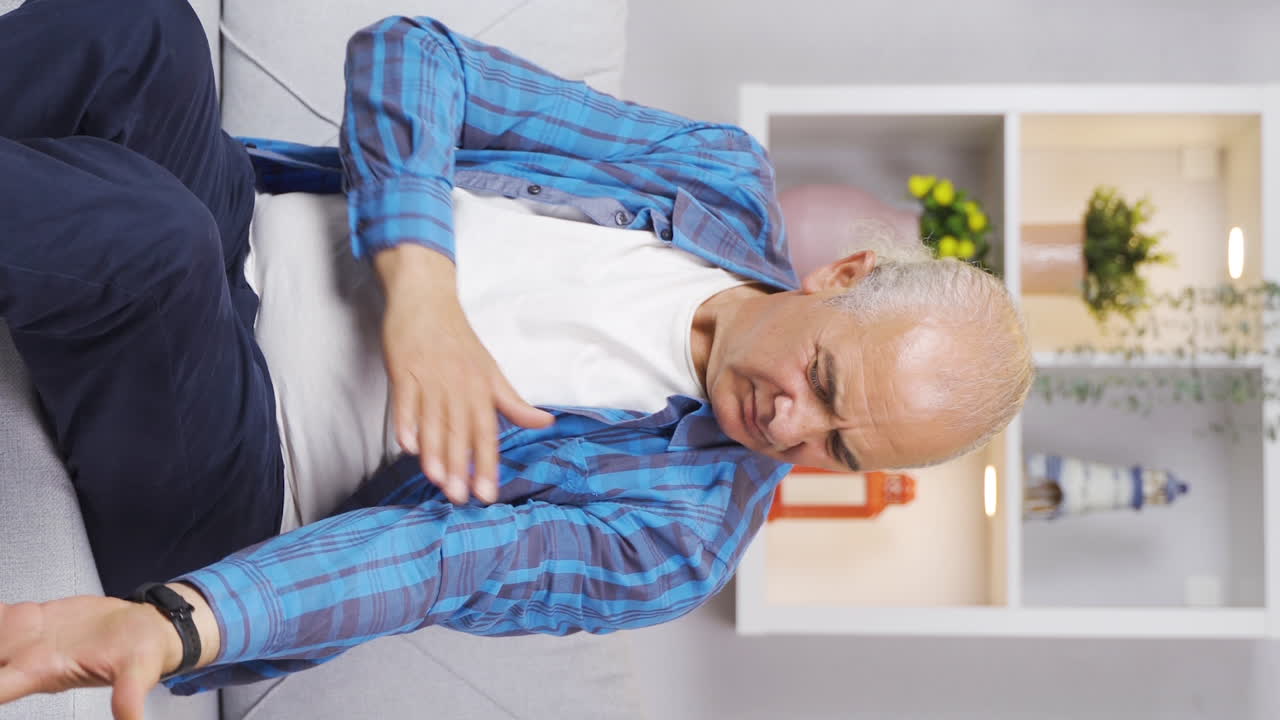 Vertical video of The old man feels distasteful and ugly.