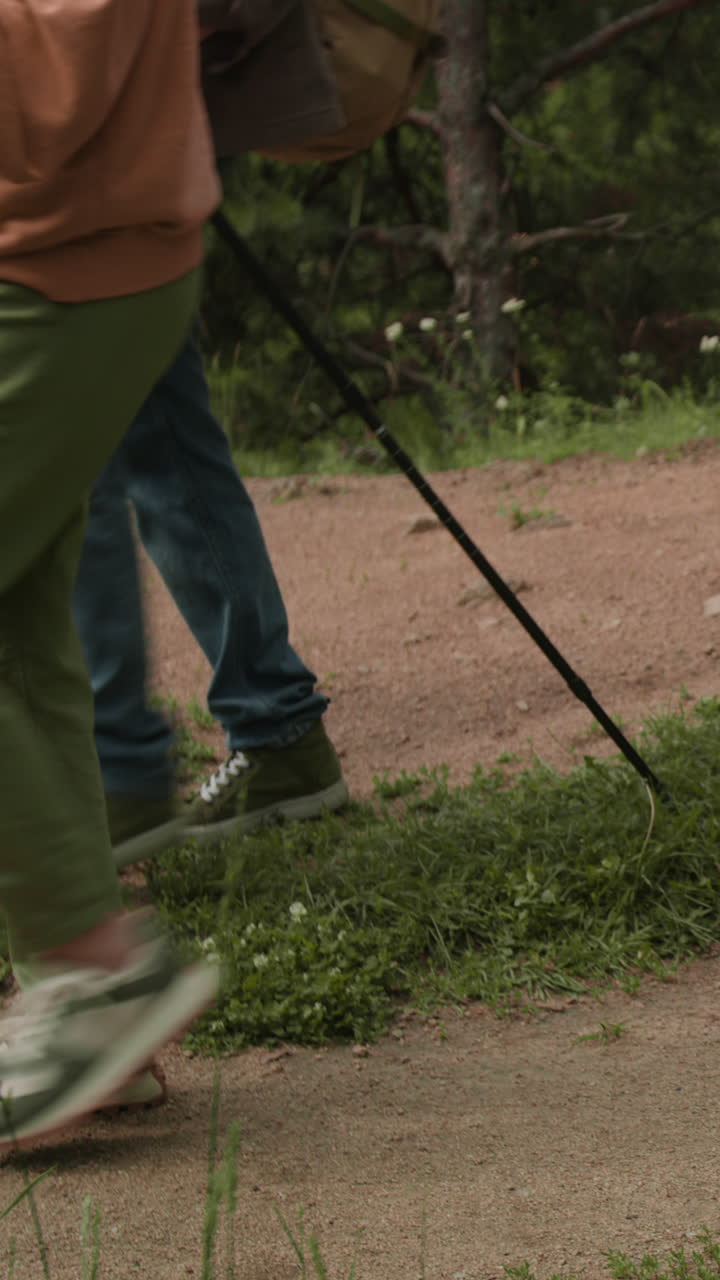 People hiking on a dirt trail