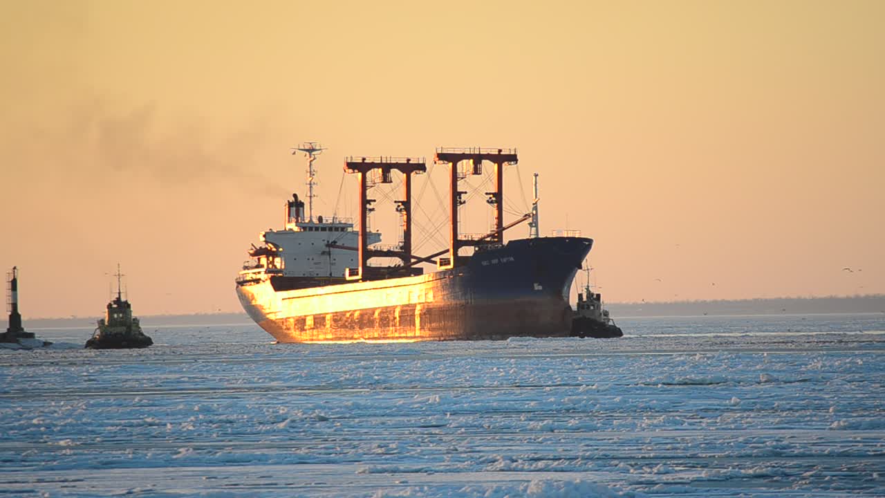 Cargo ship. The frozen sea and decline